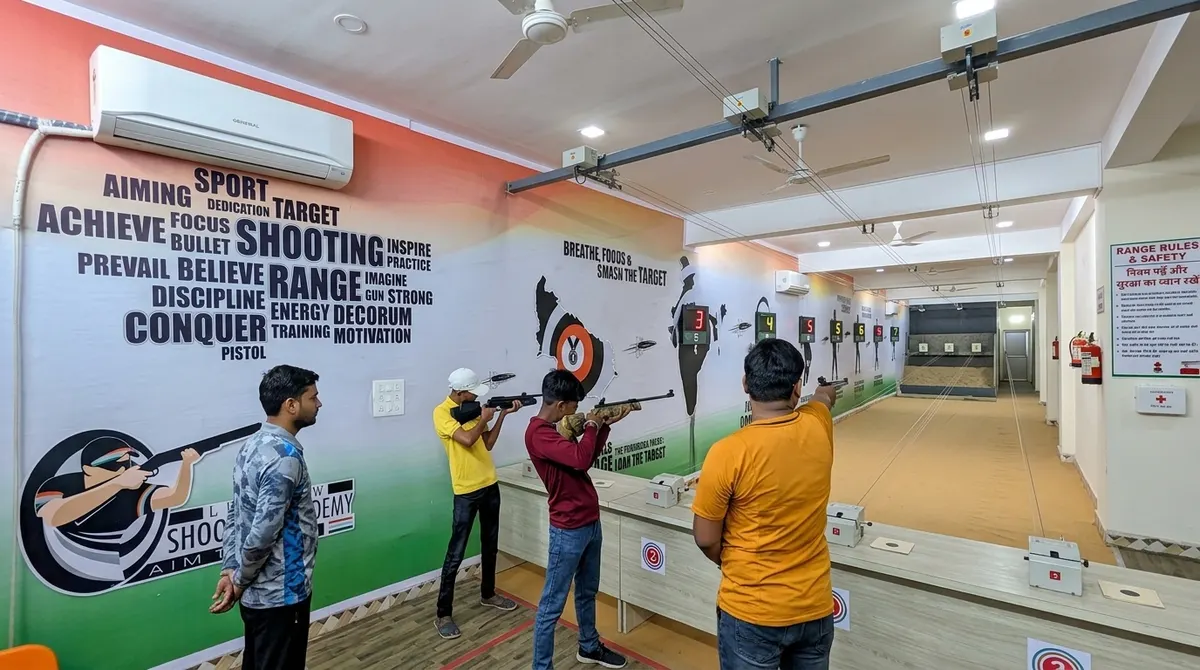 Shooter in position on the 10m firing line at Lucknow Shooting Academy